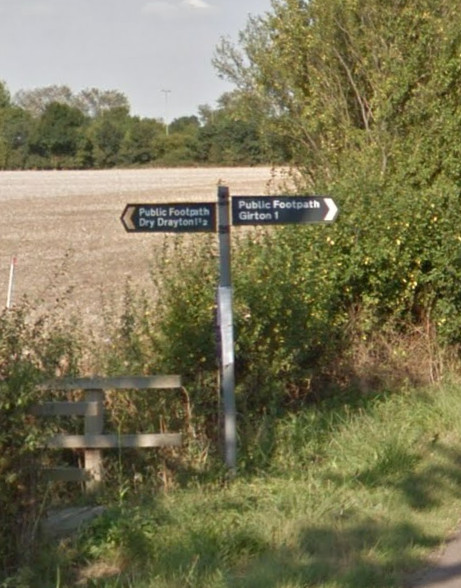 The sign says Girton, one mile -- not any more!