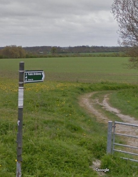 The sign says Girton, two and a quarter miles -- not any more!
